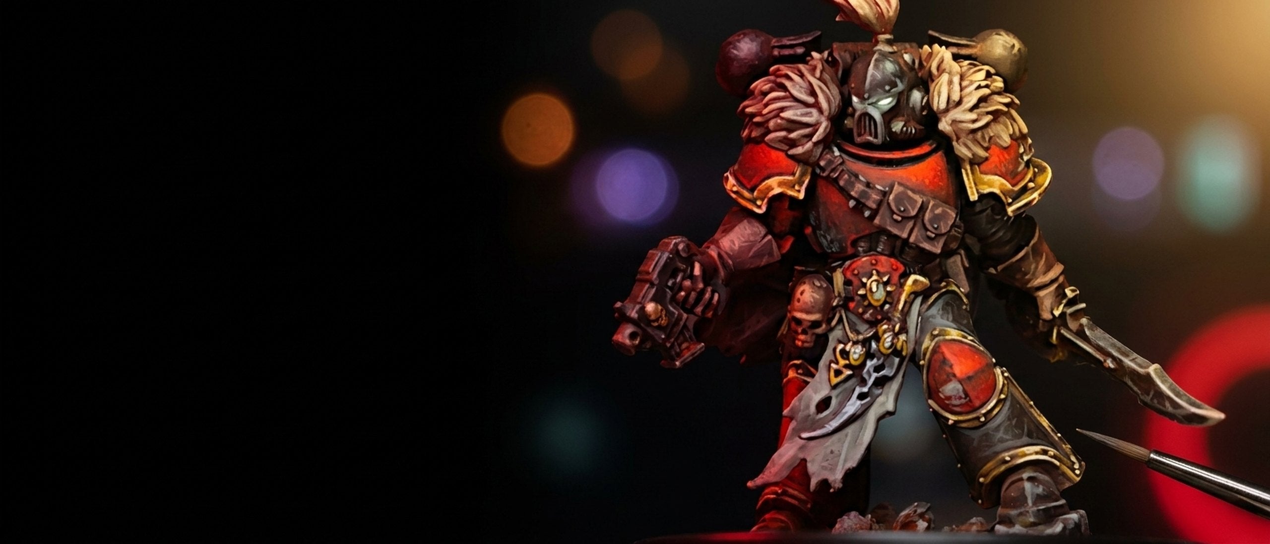 Red and bronze armoured warrior miniature